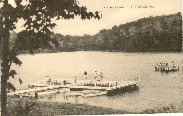 A postcard with a photograph of a group of on a dock at a lake and the title "Camp Ramah, Lake Como, PA"