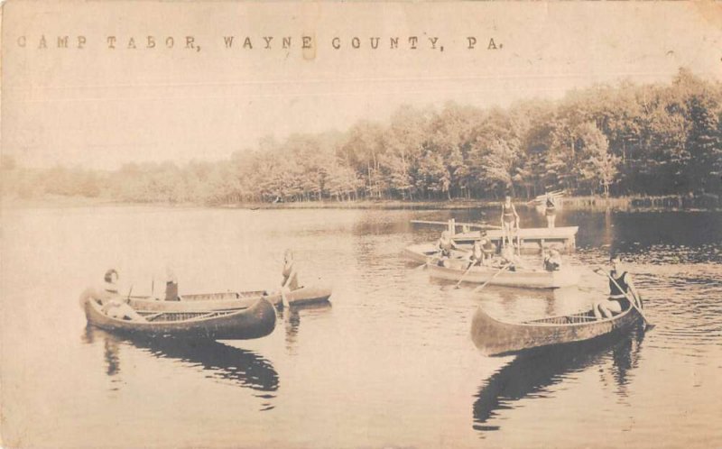 A postcard with a photograph of a group of people in canoes and the title "Camp Tabor, Wayne County, PA"