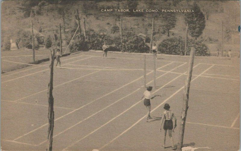 A postcard with a photograph of a group of people playing tennis and the title "Camp Tabor, Lake Como, Pennsylvania"