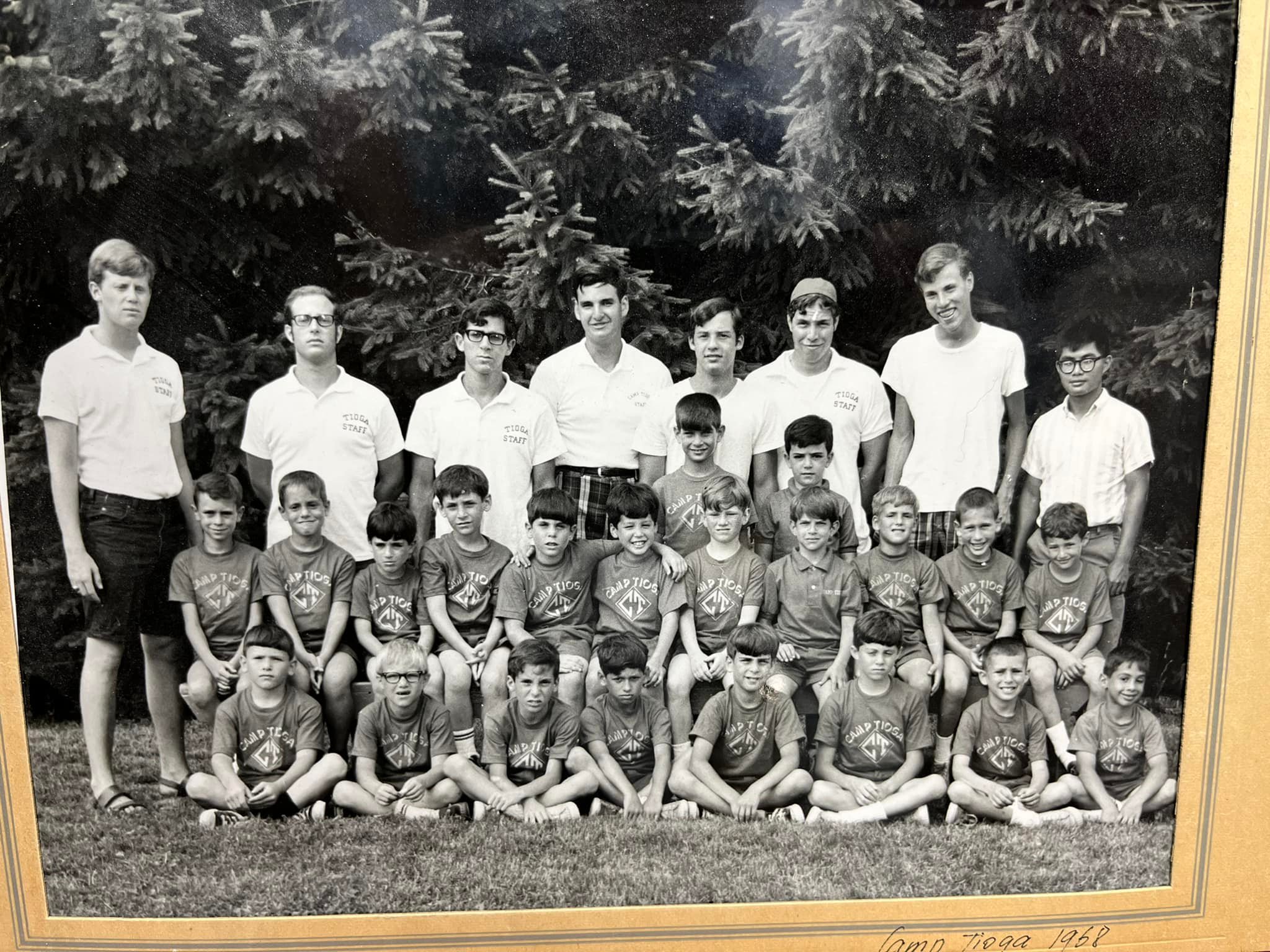 A photograph of a group of boys and staff wearing Camp Tioga shirts
